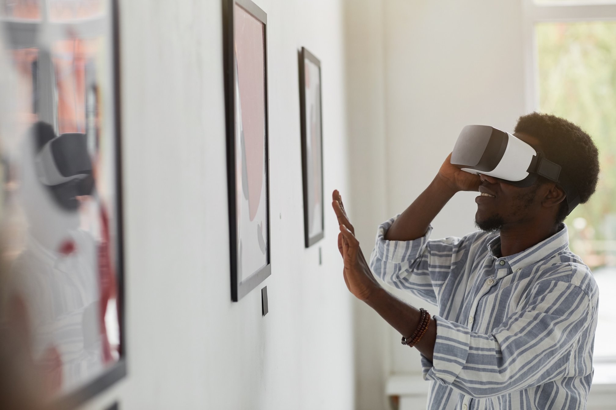 Young Man Wearing VR in Museum of Modern Art